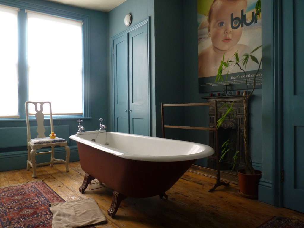 The bathroom with acres of chaste blue paint covering walls and joinery is perhaps the most perfect room of all.